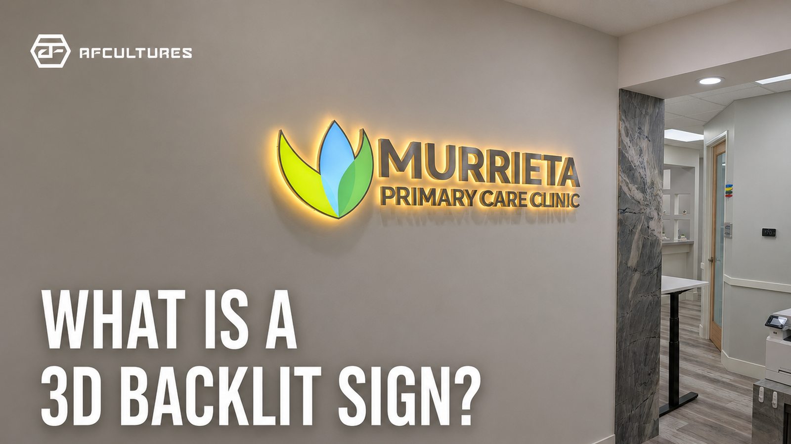 Custom 3D backlit metal logo sign with halo lighting on a commercial wall