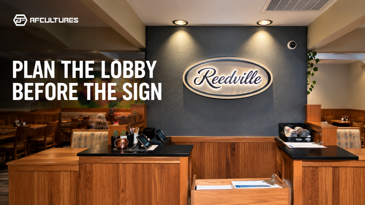 Business lobby sign shown within a complete reception wall and office space