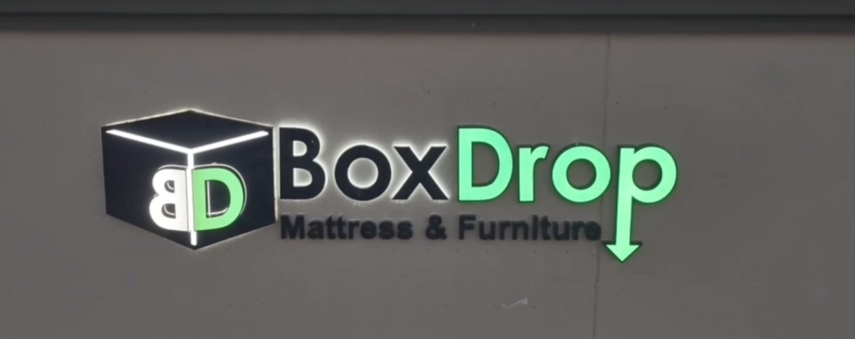 boxdrop retail storefront with 3d signs displaying brand logo and store entrance