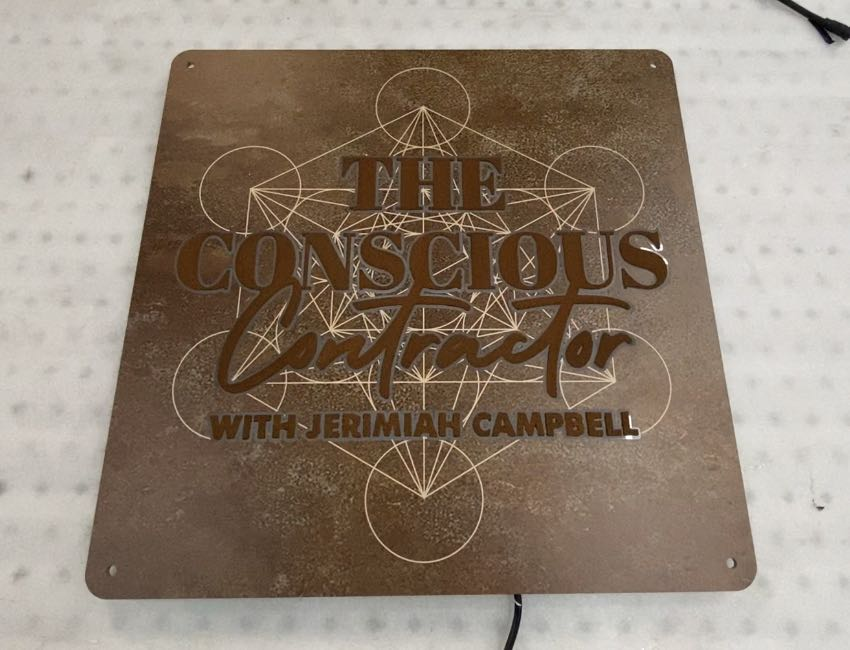 the conscious contractor podcast logo and metal signage