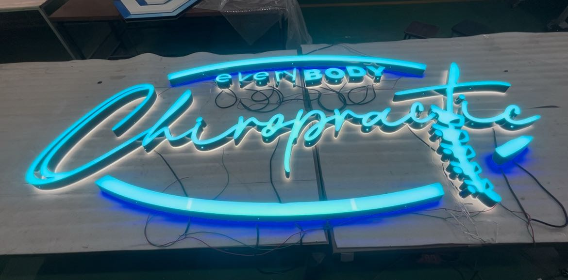 everybody chiropractic healthcare 3d sign logo on building