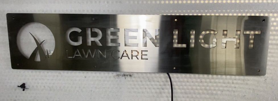 metal signs for personal lawn care services from green light lawn care inc