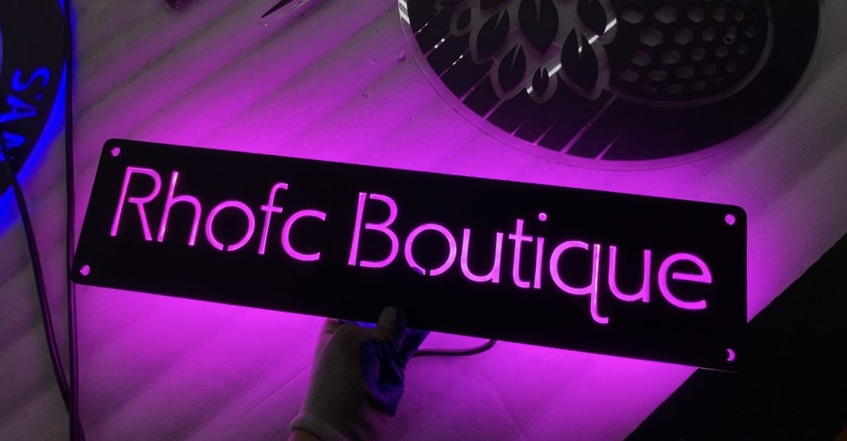 metal sign display at rhofc boutique retail store