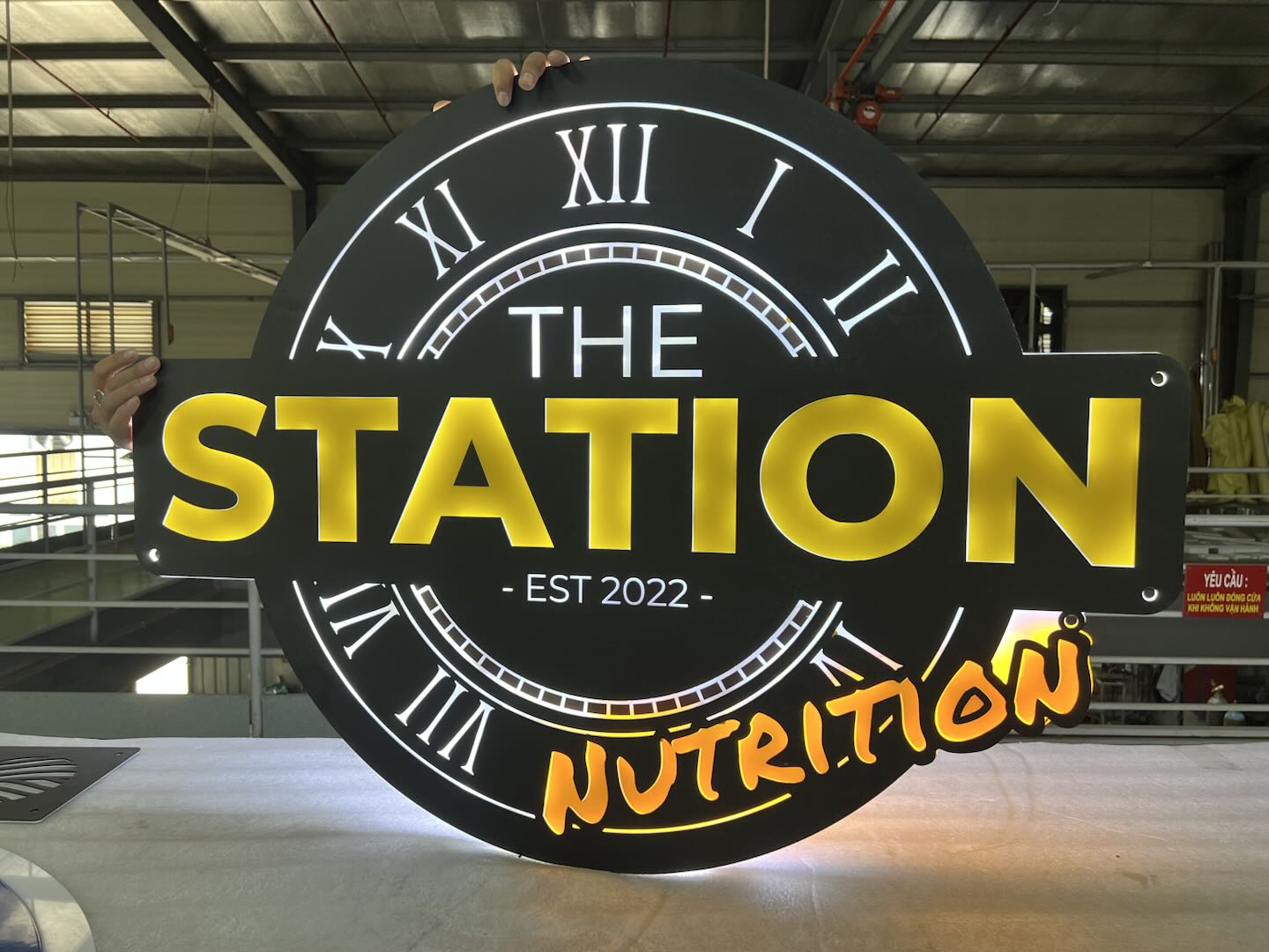 metal sign for station nutrition retail location