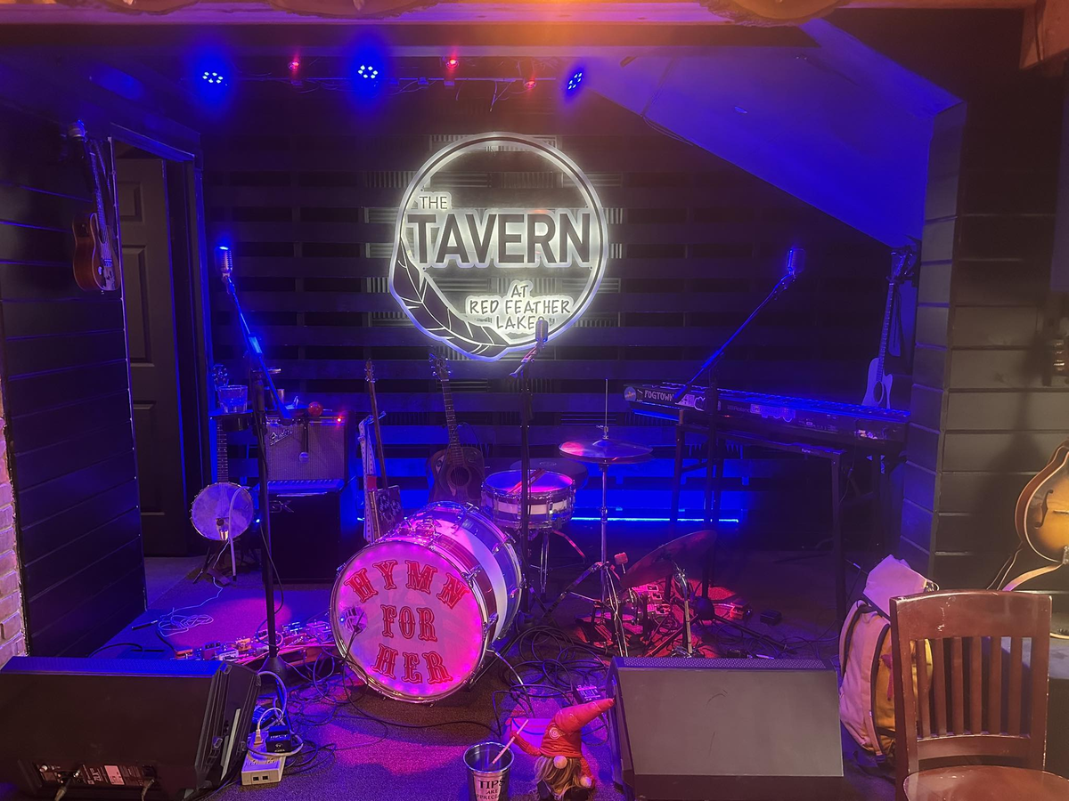 metal signs at the tavern at red feather lakes featuring restaurant and bar branding