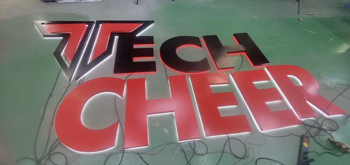 tech cheer logo in blue and white
