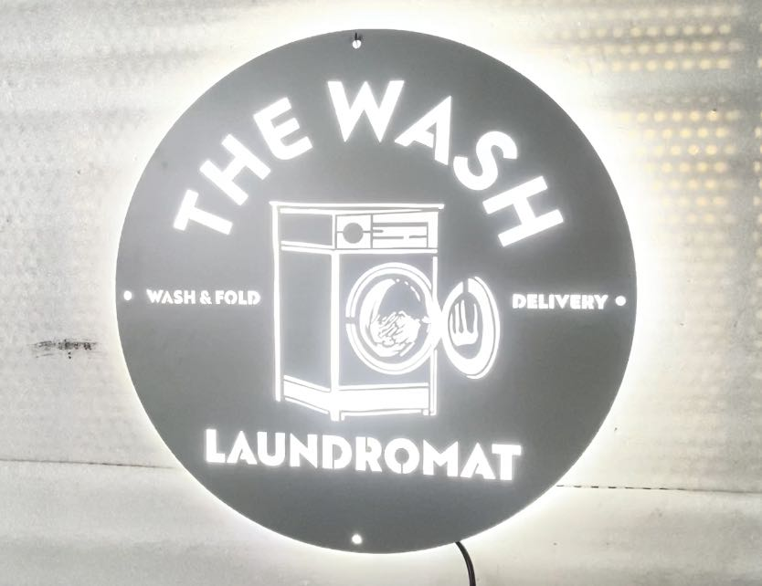 laundromat personal services metal signs at the wash texas