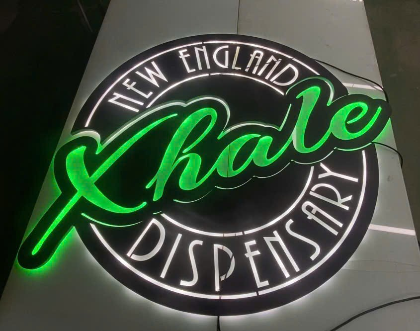 xhale new england retail metal signs displayed in store