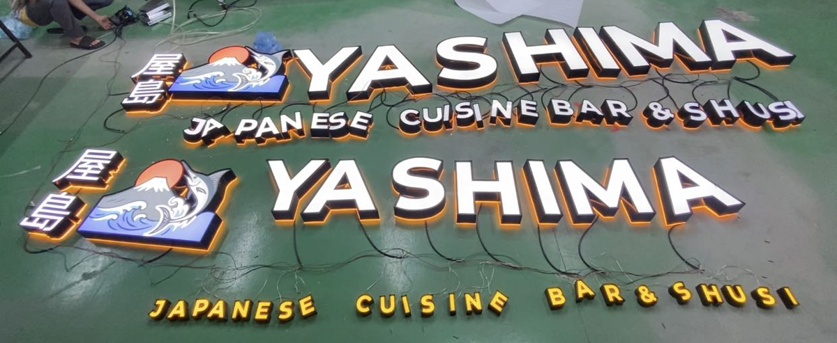 3d restaurant and bar signage for yashima featuring illuminated letters